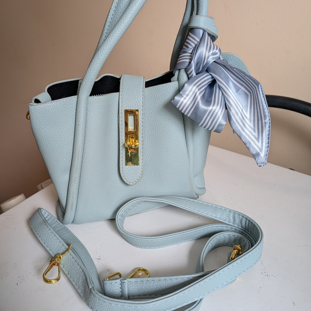 Elegant Light Blue Handbag with Bow Accent
